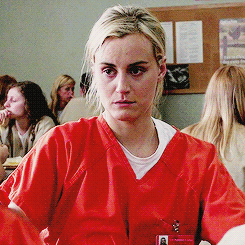 Piper from Orange is the New Black feeling sorry for herself.